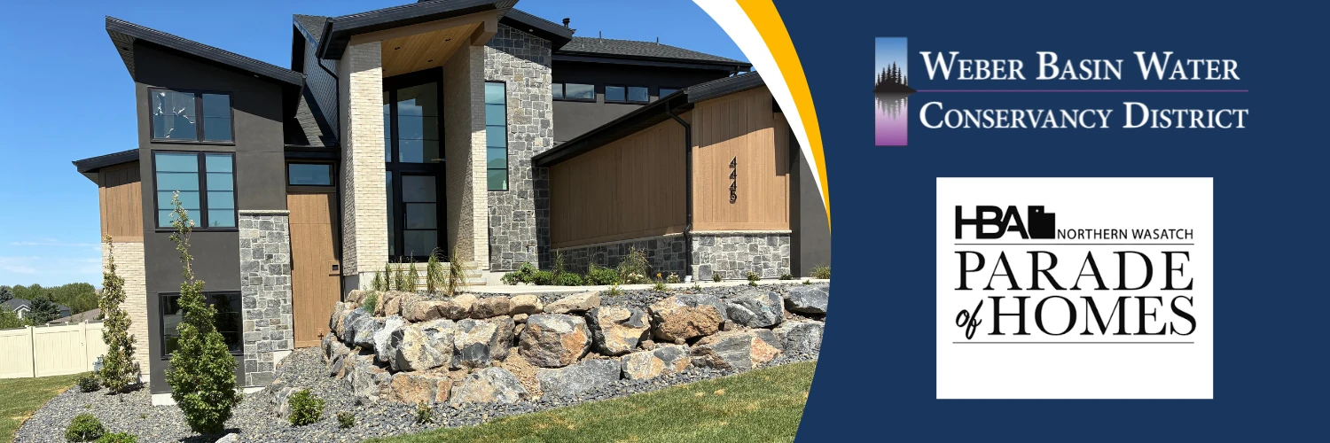 A modern Parade of Homes house with a boulder and gravel front yard. Weber Basin Water Conservancy District and Northern Wasatch HBA Parade of Homes